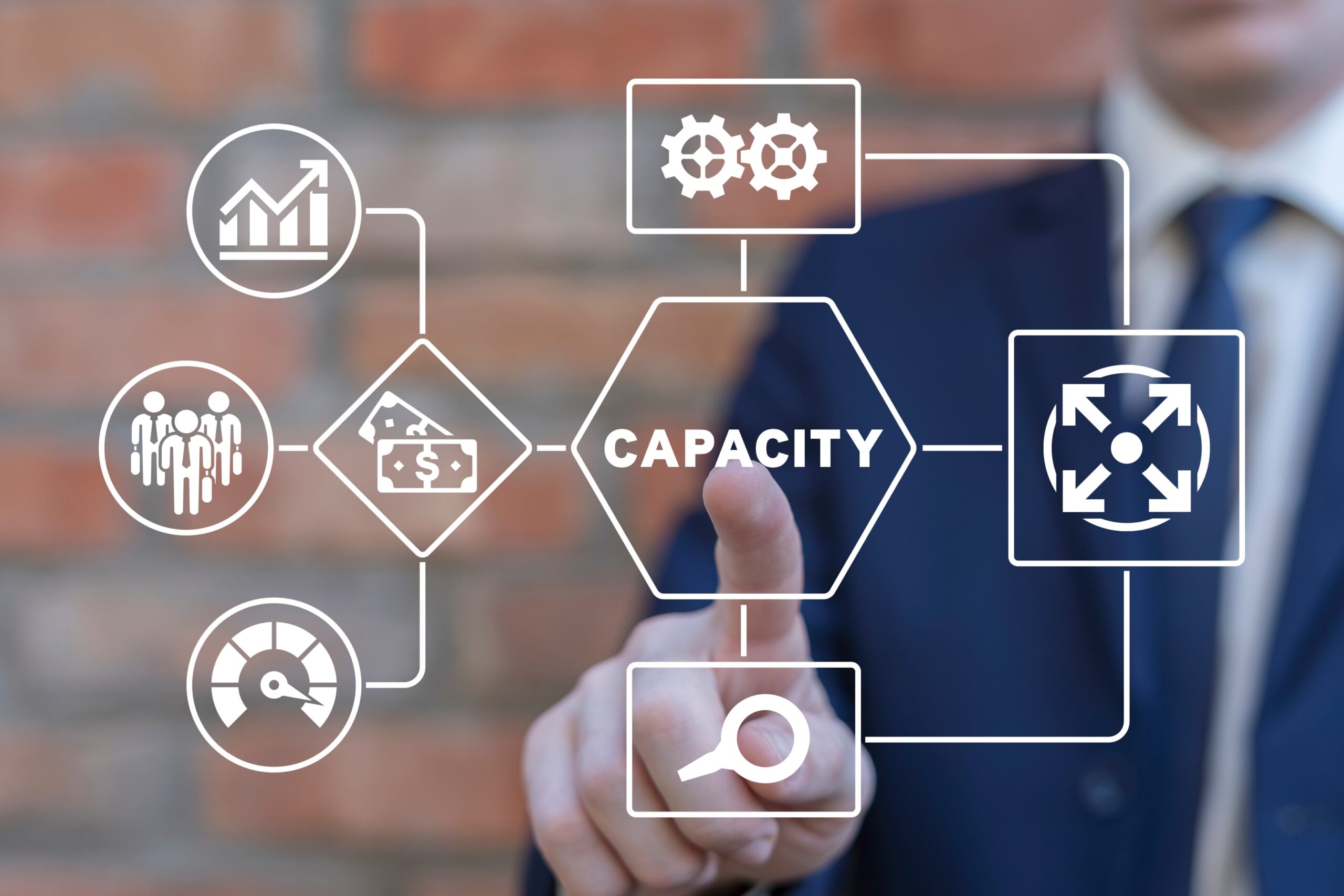 Top Strategies for Managing Capacity Effectively Managing capacity ensures your resources align with your business needs, avoiding underutilization and overwork. This article will cover key strategies and benefits of capacity management, practical tools, and real-world examples for better resource allocation. Key Takeaways Capacity management is essential for aligning resource availability with business demand, preventing both overutilization and underutilization of resources. Effective capacity management leads to enhanced resource utilization, improved project timelines, and increased employee satisfaction, allowing organizations to adapt rapidly to market changes. Implementing structured approaches and utilizing modern tools for capacity management can help organizations optimize operational efficiency and achieve strategic goals. Understanding Capacity Management Capacity management is akin to steering a ship through turbulent waters. It’s a structured approach involving three main steps: measuring resource needs, analyzing usage, and tracking progress to ensure smooth sailing. Understanding capacity management is vital for addressing challenges and improving overall management plans, allowing organizations to thrive in dynamic markets. A proper capacity management process aims to ensure accurate data entry. It also focuses on enhancing overall organizational efficiency. But what exactly does capacity management entail? Let’s delve into its definition and key objectives to get a clearer picture. Definition of Capacity Management Capacity management refers to a project management and resource allocation technique aimed at ensuring that a business’s output capabilities align with its resource availability. In essence, it ensures resources are as productive as possible, delivering work on time while avoiding burnout. This involves not just managing physical resources but also human resources, ensuring staff have the necessary skills and availability to meet project demands. At its core, capacity management encompasses the total sum of resources needed to meet calculated demand levels, aligning strategic goals with actual resource capabilities. The end goal is to have the right capacity at the right time to meet demand, avoiding both over- and under-utilization of resources. Key Objectives of Capacity Management The primary objectives of capacity management revolve around maximizing productivity and profit by utilizing resources effectively. Proper capacity management ensures that organizations are ready to meet upcoming project demands without overstaffing, maintaining a delicate balance between available resources and business needs. Implementing capacity management best practices allows organizations to achieve more straightforward and effective capacity management, significantly impacting overall productivity. Key performance indicators for capacity management include capacity utilization, throughput, cycle time, and work in progress, all of which help measure and enhance performance. Focusing on these objectives ensures businesses have the right resources available at the right times, leading to smoother operations, better project outcomes, and a more competitive edge in the market. Benefits of Effective Capacity Management Effective capacity management offers numerous benefits. These advantages are diverse and significant. It’s essential for preventing resource wastage and optimizing business operations, allowing companies to adapt swiftly to market demands. This adaptability is crucial in maintaining efficiency and staying competitive. Many companies across various industries apply capacity management practices to better utilize their resources and improve overall efficiency. This approach not only enhances productivity but also improves project timelines and increases employee satisfaction. Let’s explore these benefits in more detail. Enhanced Resource Utilization One of the primary benefits of effective capacity management is improved resource utilization. Anticipating needs and ensuring adequate resources are available allows businesses to maximize production output and meet demand efficiently. This involves implementing a solid capacity planning system that significantly reduces resource underutilization, leading to better overall performance. Utilization rates, calculated by comparing billable hours to total hours worked, provide insights into workforce efficiency. Healthy utilization targets should account for internal meetings, non-project work, context-switching time, and realistic project numbers, ensuring resources are used optimally without overburdening employees. Improved Project Timelines Effective capacity management is instrumental in meeting project deadlines by optimizing resource allocation and availability. Ensuring resources are available when needed helps organizations reduce delays and enhance project timelines. This coordination facilitates seamless operations from project initiation to completion, making it easier to manage projects efficiently. Efficient capacity management is crucial for achieving these goals. Inaccuracies in forecasting can lead to insufficient resources during peak demand periods, compromising project timelines. Effective forecasting of future resource demands allows companies to better prepare for project workloads and allocate staff accordingly, ensuring smoother project execution. Increased Employee Satisfaction Proper capacity management fosters a balanced workload among employees, preventing burnout and enhancing job satisfaction. When workloads are evenly distributed, employees are less likely to experience the stress and exhaustion that can lead to significant morale issues, disengagement, and even turnover. By maintaining a balanced workload, organizations can create a more positive and productive work environment. Capacity planning aids in managing employee expectations, helping to maintain morale and retention rates. It ensures that employees are not overwhelmed with too many tasks at once, allowing them to perform their duties more effectively and with greater satisfaction. Common Challenges in Capacity Management Despite its benefits, capacity management comes with its own set of challenges. Common issues include misalignment between teams, inaccurate forecasting, and problems with resource utilization. These challenges can significantly impact a company’s ability to meet project deadlines and maintain operational efficiency. Every fourth manager identifies capacity as a major challenge, highlighting the significance of effective management approaches. Let’s delve into specific challenges to understand their impact better and explore how to address them. Misalignment Between Teams Misalignment between sales and delivery teams can lead to project delays and dissatisfied clients. Differences in priorities between these teams create significant capacity management challenges, as each group may have conflicting goals and timelines. This misalignment disrupts project flow and resource allocation, necessitating better communication and coordination. Inaccurate Forecasting Accurate scheduling is essential for effective resource capacity planning, as incorrect forecasts can lead to resource shortages at crucial project phases. Inaccurate forecasts hinder the identification of resource conflicts, limiting the ability to adjust schedules to avoid issues. Decisions regarding resource allocation often depend on accurate forecasts, affecting whether projects are prioritized or additional resources are needed. Forecasting inaccuracies in capacity management can stem from insufficient real-time data, leading managers to rely on guesswork rather than informed decisions. Predictive workforce analytics can help businesses better anticipate future capacity needs by analyzing historical employee data. The absence of effective monitoring tools can lead to distorted perceptions of workload distribution, complicating accurate forecasting in capacity management. Overutilization and Underutilization Overburdening employees can lower job satisfaction and negatively affect their health, while underutilization can lead to wasted resources and decreased productivity. Effective capacity management increases client satisfaction by delivering quality work on time and avoiding delivery issues due to a lack of available resources. Balancing resource allocation is crucial to prevent both over- and underutilization, ensuring optimal performance and employee well-being. Key Capacity Management Strategies Businesses can adopt various strategies to navigate the complexities of capacity management. These strategies involve systematic approaches that help effectively manage resources concerning demand. Implementing capacity management allows businesses to proactively respond to market changes, optimizing resource utilization and maintaining efficiency. Manufacturing firms, for instance, often implement capacity management strategies to address variability in consumer demand, ensuring efficient production schedules. Let’s explore four key strategies: lead, lag, match, and adjustment. Lead Strategy The lead strategy allows businesses to prepare for future demands by maintaining extra capacity. This excess capacity ensures that businesses can quickly respond to increased demand without delays. However, it requires careful planning to avoid unnecessary costs and resources. Lag Strategy The lag strategy involves adding resources only when current capacity is maxed out, aligning resource availability with actual demand, and preventing overcapacity until necessary. While it helps control costs, the risks include potential overspending on underused resources and employee burnout due to stretched capacities. Match Strategy The match strategy in capacity management balances current resources with future capacity needs. Its primary objective is to adjust available resources to reflect current and near-future demands, requiring advanced resource calculation and planning capabilities, all within a capacity management strategy. However, it can be resource-intensive and reliant on assumptions, posing challenges for long-term planning. Adjustment Strategy The adjustment strategy involves adding or reducing capacity based on client demand or significant changes, allowing for real-time responsiveness to client demands or major business shifts. For example, a TV manufacturer might lease machines or hire contractors temporarily to handle fluctuating demand, demonstrating the importance of flexible capacity planning. Tools and Software for Capacity Management In today’s digital age, tools and software play a crucial role in effective capacity management. Capacity management software is designed to automate capacity management plans, providing accurate insights into capacity and demand gaps. Utilizing a centralized capacity management tool helps optimize resource allocation and project delivery, enhancing operational efficiency. AiRISTA’s solutions, for instance, offer predictive analytics and Real-Time Location Systems (RTLS) to improve decision-making in hospital capacity management, ensuring better patient outcomes and operational efficiency. Let’s explore essential features and recommended tools for capacity management. Capacity Management Software Features Effective capacity management tools must feature comprehensive reporting and forecasting capabilities to enhance decision-making. Tools like Runn provide centralized dashboards that generate reports on utilization and track KPIs, aiding in resource management. ActivTrak offers dashboards and in-depth analytics for both historical and real-time data, facilitating better insights into workforce productivity. Having an accurate view of team capacity ensures that projects align with available resources effectively. Steps to Improve Capacity Management Improving capacity management involves a series of strategic steps designed to enhance resource utilization and operational efficiency. These steps include measuring current capacity, analyzing and planning for future demands, and effectively managing capacity by implementing best practices. Following these steps ensures businesses are well-prepared to meet both current and future demands. Let’s delve into each of these steps to understand how they contribute to more effective capacity management and ultimately, to the success of your organization. Measure Current Capacity The first step in improving capacity management is to measure current capacity levels. This involves evaluating financial, human, andIT resources to get a comprehensive view of resource availability. Analyzing historical data can reveal patterns related to past capacity management issues, helping to identify potential bottlenecks and areas for improvement. Teams can calculate their current resource capacity using historical time data from time logs, providing a realistic picture of their capabilities. This assessment helps in identifying underutilized resources, allowing for better allocation and improved efficiency. Let's look at hospital admissions. According to the IHI, reducing ED boarding to under 6 hours reduced in-hospital mortality from 17.4% to 12.9% and reduced the length of stay. But first, you must be able to measure wait times. Hospitals that provide an RTLS-enabled patient tag can not only monitor patient wait times and alert them to excessive waits, but they can also track the patient’s location and deliver a message when it's their turn. Capio St. Göran Hospital in Stockholm Sweden uses AiRISTA’s B4n messaging tag to manage patients waiting for surgery. The result was reduced delays, improved patient throughput, and increased patient satisfaction. Analyze and Plan for Future Demands Once current capacity is measured, the next step is to analyze and plan for future demands. Methods such as forecasting, market research, and customer surveys are used to project needed resources. Historical data plays a crucial role in this process, providing insights into trends for workforce capacity planning and helping to identify predictable seasonality in project demands. Consulting sales departments about upcoming projects can greatly enhance resource forecasting accuracy, ensuring resources are allocated effectively. A technology firm, for example, utilized predictive analytics to forecast demand, enabling effective resource allocation during peak periods. Implement Best Practices Implementing best practices involves establishing a structured approach to capacity management, which includes measuring needs, analyzing usage, and tracking progress. Many leaders mistakenly rely on instinct rather than data for capacity planning, leading to potential miscalculations. A well-structured capacity planning process minimizes both resource oversupply and undersupply, enhancing overall productivity. Monitoring and Adjusting Capacity Management Plans Capacity management is an ongoing process that requires continuous monitoring and adjustment. Regular assessments ensure that capacity management plans align with changing market conditions and organizational needs. Effective capacity management ensures resources are efficiently allocated across projects, helping organizations avoid resource bottlenecks. Different capacity management approaches, such as the match strategy, offer flexibility by enabling organizations to increase resources as needed based on current demands. Let’s explore how regular reviews and adaptability contribute to effective capacity management. Regular Capacity Reviews Regular capacity assessments are essential to align resources with ongoing project needs and avoid unnecessary financial expenditures. Scheduled evaluations help identify areas needing improvement and ensure capacity management practices remain cost-effective. Recurring tweaks are a requirement for capacity management planning, ensuring that strategies are always aligned with actual business demand. Adapting to Changes Flexibility in capacity management is crucial to meet unforeseen changes in demand and effectively utilize resources. Regularly monitoring capacity management plans ensures they align with actual business demand and market trends, allowing businesses to remain competitive. Adapting to changes in client demand is essential, and an adjustment strategy can help organizations respond dynamically to these shifts. Scheduling regular capacity reviews helps assess the effectiveness of capacity management strategies and make necessary adjustments, ensuring continuous operational efficiency. Capacity Management Metrics Metrics are vital for assessing the performance of capacity management. Key metrics include utilization rates, performance metrics, and efficiency rates, which help evaluate and enhance organizational performance. These metrics provide insights into how well resources are utilized and identify areas for improvement. Throughput, for example, measures the speed at which products or services are delivered, serving as a critical performance metric in capacity management. Let’s delve into specific metrics to understand their importance in effective capacity management. Utilization Rates Utilization rates are calculated by dividing actual output by potential output and expressing it as a percentage. For instance, the weekly capacity for 50 employees each working 40 hours is 2,000 hours. Monitoring these rates provides insights into workforce efficiency and helps identify underutilized resources. A manufacturing company, for example, improved its overall equipment effectiveness by 25% after adopting a comprehensive capacity monitoring system. This highlights the importance of tracking utilization rates to enhance production efficiency and optimize resource allocation. Performance Metrics Performance management in capacity management shows the speed at which a system can handle requests. It indicates how quickly the system can respond to user needs. To optimize productivity, it’s essential to measure resource needs, analyze their usage, and track progress. Productivity metrics can include output per labor hour or total output relative to input, providing a clear picture of resource efficiency. By monitoring these metrics, businesses can make informed decisions to enhance business capacity management practices, ensuring they monitor actual business demand and maintain operational efficiency. Why Capacity Management is Important Effective capacity management is essential for optimizing resources, meeting project deadlines, and enhancing employee satisfaction. By understanding and implementing key capacity management strategies, businesses can navigate common challenges and ensure they have the right resources available at the right times. Capacity management tools and software play a crucial role in this process, providing the necessary insights and automation to streamline resource allocation and project planning. By continuously monitoring and adjusting capacity management plans, businesses can adapt to changing demands and maintain operational efficiency. Embrace these strategies and tools to elevate your capacity management practices and drive your business toward success. Frequently Asked Questions What is capacity management? Capacity management is a crucial technique that ensures a business's output aligns with its available resources, optimizing efficiency and productivity. Effective capacity management leads to better resource allocation and improved project outcomes. What are the key objectives of capacity management? The key objectives of capacity management are to maximize productivity and profit through effective resource utilization, ensure readiness to meet project demands and maintain a balance between available resources and business needs. What are some common challenges in capacity management? Common challenges in capacity management include misalignment between teams, inaccurate forecasting, and issues with resource utilization, which ultimately affect project deadlines and operational efficiency. Addressing these challenges is crucial for enhancing organizational performance. What are the benefits of effective capacity management? Effective capacity management leads to enhanced resource utilization, improved project timelines, and increased employee satisfaction, ultimately driving better overall business performance. What tools are recommended for capacity management? For effective capacity management, tools such as ClickUp, Resource Guru, Float, and Runn are recommended due to their user-friendly interfaces and capability to integrate with other software systems, thereby enhancing resource planning