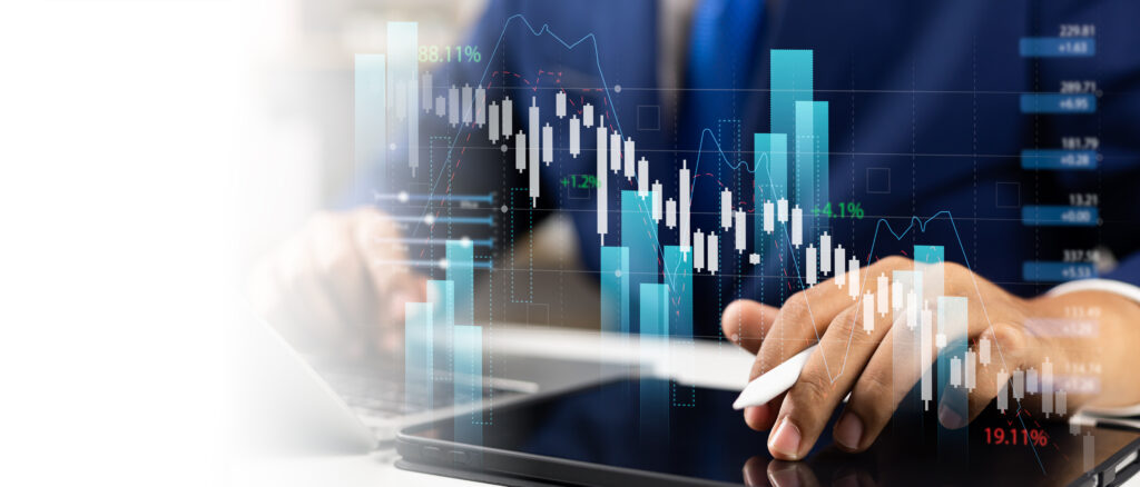 Business professional analyzing financial data on a tablet with overlaying bar graphs and stock charts, representing data-driven decision-making and market analysis.